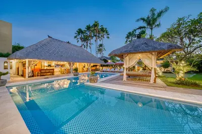 a pool at a resort with a gazebo at Villa Kalis, 10 BR family and group Villa in Seminyak