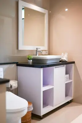 a bathroom with a sink and a toilet at Villa Laksmi Legian in Seminyak