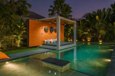 a house with a swimming pool with a gazebo at Villa Aless - Designer 4BR Villa with Sauna, Jacuzzi, Ice Bath, Gym & Rooftop in Canggu