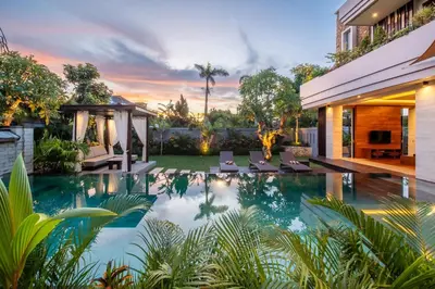 a swimming pool in the backyard of a house at The Amarta Villa in Jimbaran