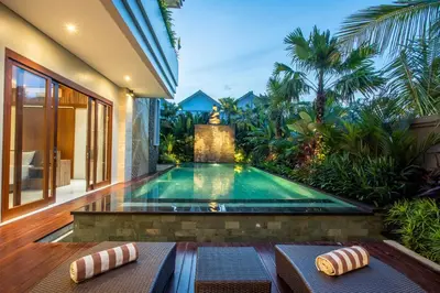 a swimming pool in the backyard of a villa at The Amarta Villa in Jimbaran