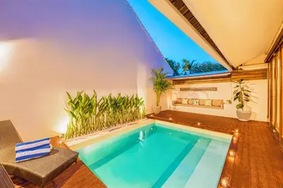 a swimming pool in a house with a window at NEW Fresh 3BD Prime Location Villa in Seminyak