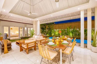 an open living room with a table and chairs at PROMO 3BD Tropical Villa in Central Umalas in Canggu