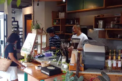 a man and a woman standing at a counter at Villa Keane Bali 2 BR, Private Pool in Seminyak