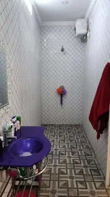 a bathroom with a purple sink and a shower at Villa Keane Bali 2 BR, Private Pool in Seminyak
