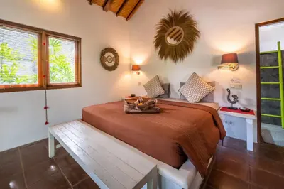 a bedroom with a bed in a room at Villa Fendi Seminyak in Seminyak