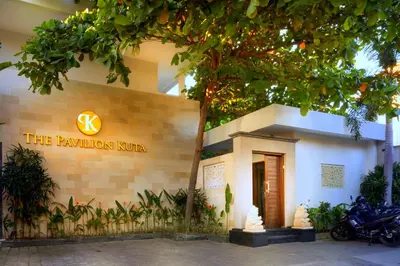 a building with a motorcycle parked in front of it at The Pavilion Hotel Kuta in Kuta