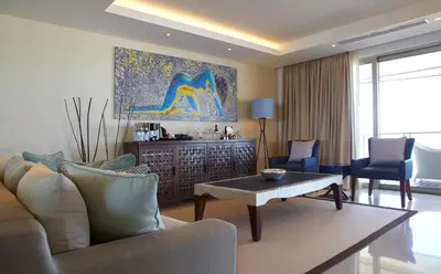 a living room with a couch and a table at Double - Six, Luxury Hotel - Seminyak in Seminyak