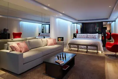 a living room with a couch and a bed at Double - Six, Luxury Hotel - Seminyak in Seminyak