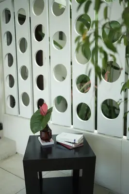 a black table with a plant on top of it at VILLA CELAVI 15 in Kerobokan
