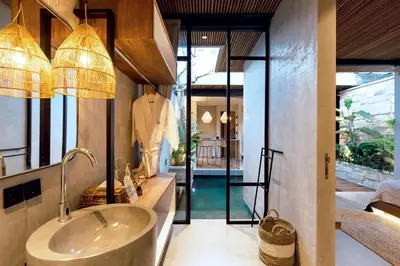 a bathroom with a sink and a mirror at Danu Villas Bali in Kerobokan