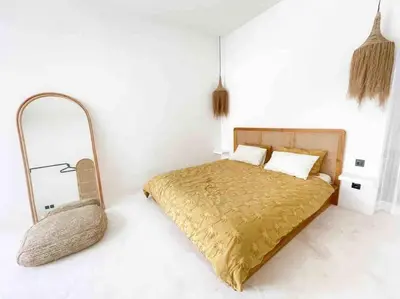 a bedroom with a gold bed and a mirror at Renovated 2BD Oasis with POOL - CasaEra in Seminyak main hub in Seminyak