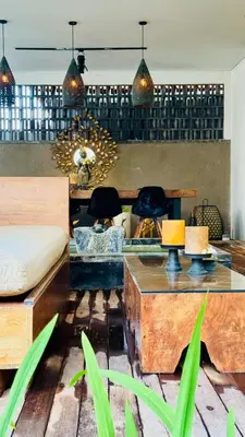 a living room with a couch and a table at Solaris Private Villa Club Residence Canggu in Canggu