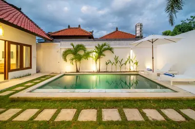 a swimming pool in the backyard of a house at 2 bedroom Balinese private pool villa in Seminyak in Seminyak