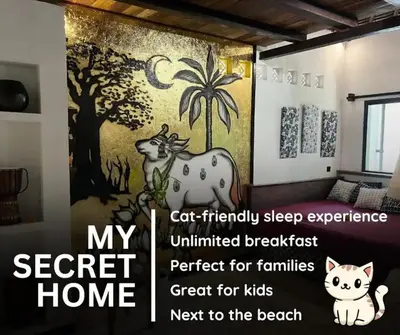 a painting of a cow and a cat in a room at My Secret Home in Seminyak