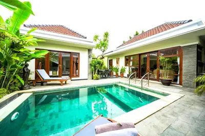 a swimming pool in front of a villa at Villa VINO - LEGIAN - 3 bedroom - 3 bathroom Villa - Great Location in Seminyak