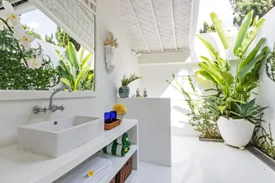 a bathroom with a sink and plants at Pineapple Hill 4 Bed Luxury in Seminyak