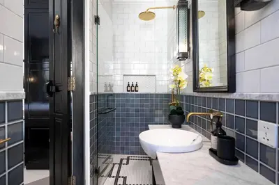 a bathroom with a sink and blue tiles at Martini Beachside Villa 3 in Canggu
