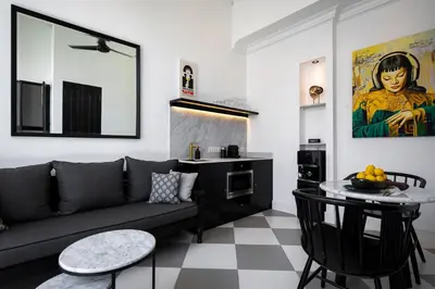 a living room with a couch and a table at Martini Beachside Villa 4 in Canggu