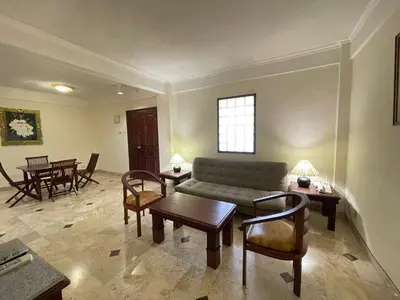 a living room with a couch and chairs and a table at Beach Apartment inside Resort Walking Distance to the beach in Seminyak