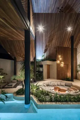 a pool with a hot tub in the middle of a building at Can Maestro Bali by House of Winds - Lush Sanctuary near Canggu in Kerobokan