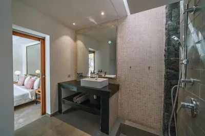 a bathroom with a sink and a mirror at Villa Kalila: Elegant 2 BR Villa in Perfect Location ! in Seminyak