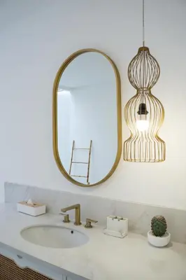 a bathroom with a sink and a mirror at Villa Weiss Berawa in Canggu
