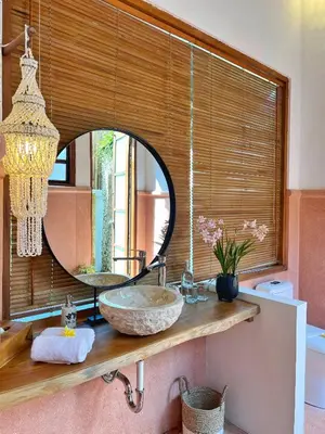 a bathroom with a sink and a mirror at Villa Nicole 5BR Paradise, quiet area in Central Oberoi Seminyak in Seminyak