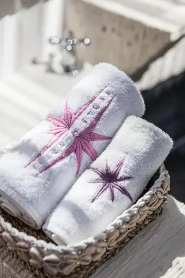 a pile of towels in a basket on a sink at Villa Xaloc by House of Winds - Stunning Balinese retreat next to Canggu in Kerobokan