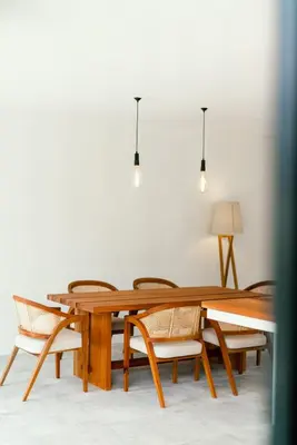 a dining room table with chairs around it at Umalas Living Villa in Canggu