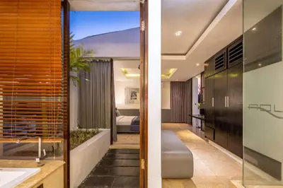 a bathroom and a bedroom in a house at Villa Aqua Seminyak in Seminyak
