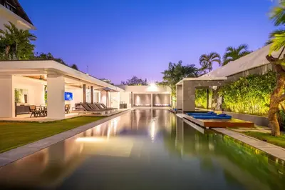 a swimming pool in the backyard of a house at Villa Aqua Seminyak in Seminyak