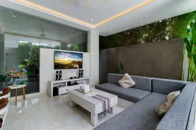 a living room with a couch and a table at Fantastic 3 Bed Villa, Walk to Beach, Sunny Pool in Seminyak