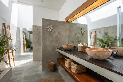 a bathroom with two sinks and two baskets at Villa Bahia by Optimum Bali Villas in Seminyak