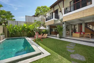 an image of the backyard of a house with a swimming pool at The Kumpi Villas in Seminyak