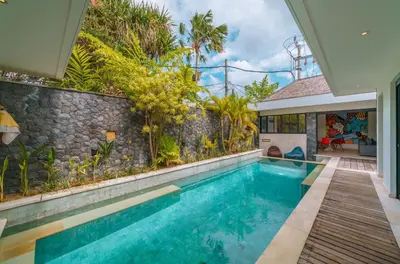 a swimming pool in the backyard of a house at Villa Yasmee : Cozy and Modern 2 BR w/ Pool in Seminyak ! in Seminyak