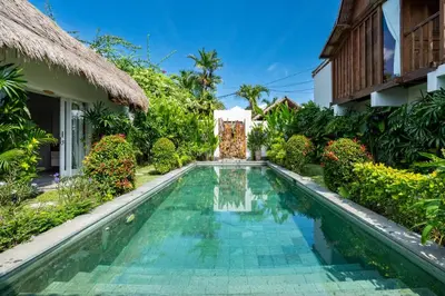 a swimming pool in the courtyard of a villa at Villa Aniri - Seminyak Villa - Walk to Beach & Cafés in Seminyak