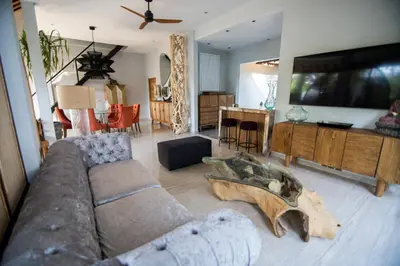 a living room with a couch and a table at Villa Loba in Seminyak