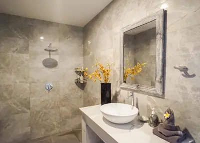 a bathroom with a sink and a mirror at Villa Indalia in Seminyak