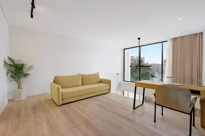 a living room with a couch and a table at The Oasis Smart Villa in Canggu