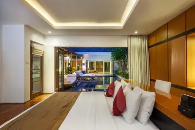 a room with a couch and a living room at Villa Illam in Seminyak