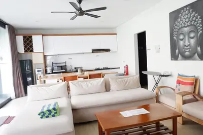 a living room with a couch and a table at The BALIem Villa in Jimbaran