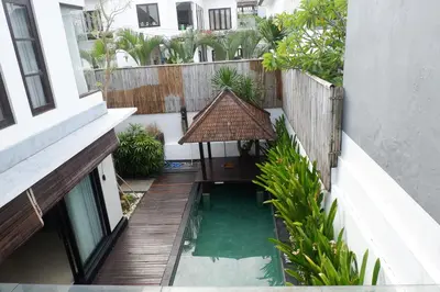 an external view of a balcony of a building at The BALIem Villa in Jimbaran