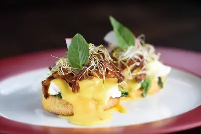 two pieces of food on a white plate at Selog Villa 4 in Seminyak