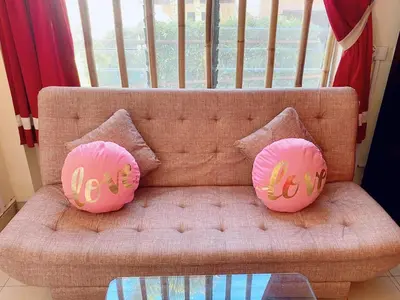 two hello kitty pillows sitting on a couch at Villa Kinandari Bukit Jimbaran in Jimbaran