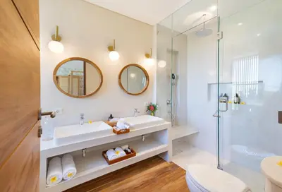 a bathroom with a sink and a shower at Villa ElyOs Canggu by Nagisa Bali in Canggu