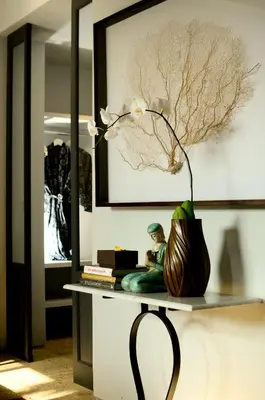 a vase sitting on a table in a room at Room & Vespa 1 - Stay Central Seminyak Near Beach in Seminyak