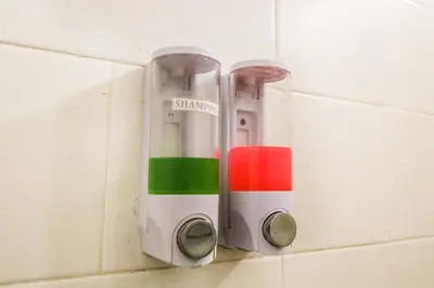 a pair of measuring utensils hanging on a wall at Graha Wedha Suite Kuta by kamara in Kuta