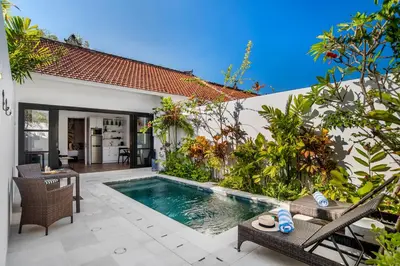 a swimming pool in the backyard of a villa at Villa Balik II Seminyak in Seminyak