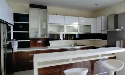 a kitchen with white cabinets and white counter tops at Casa de Prospera - 3BR Villa with Private Pool in Nusa Dua